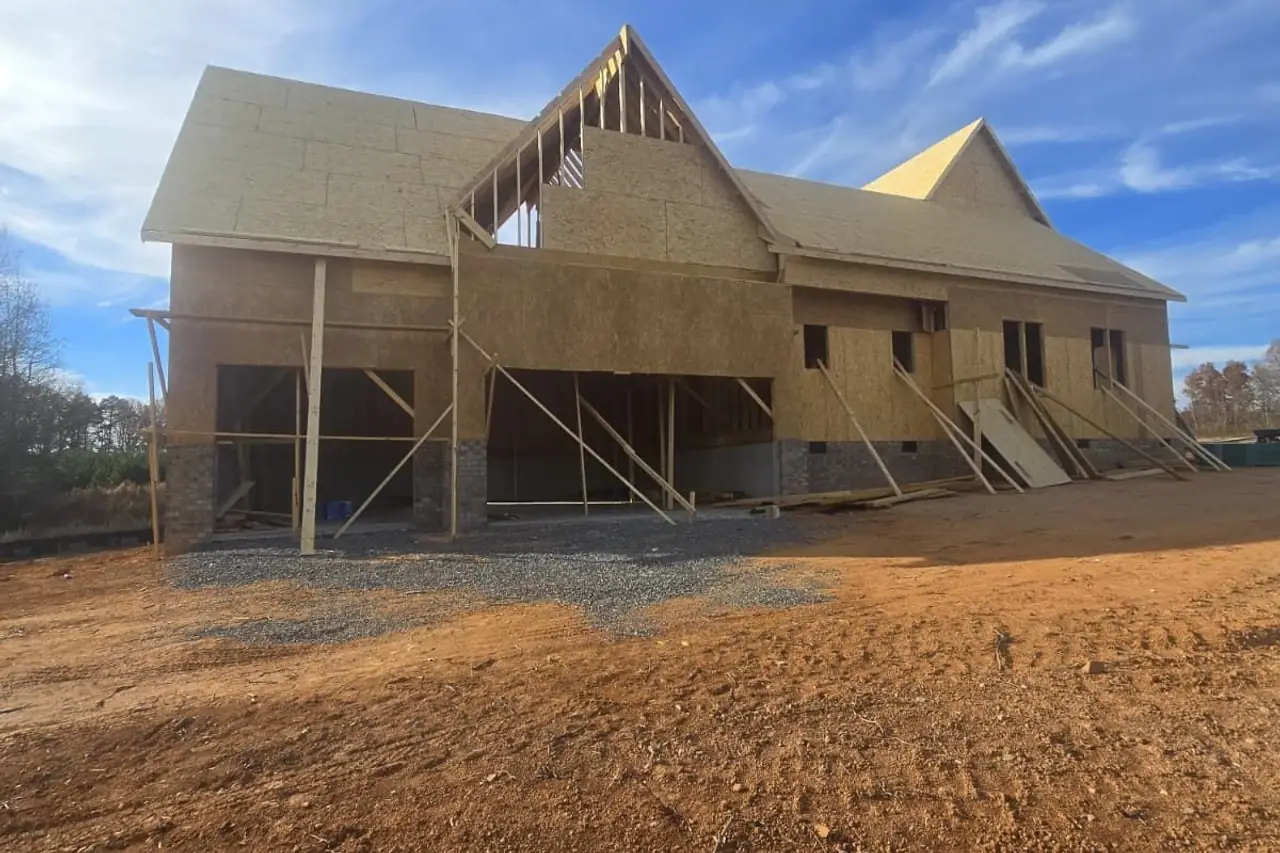 New home under construction with the wood framing up